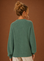 Back view of women's knit cardigan showing clean hemline and fitted shoulders