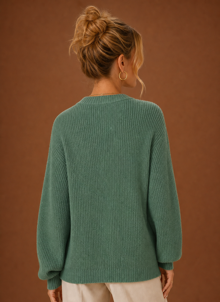 Back view of women's knit cardigan showing clean hemline and fitted shoulders