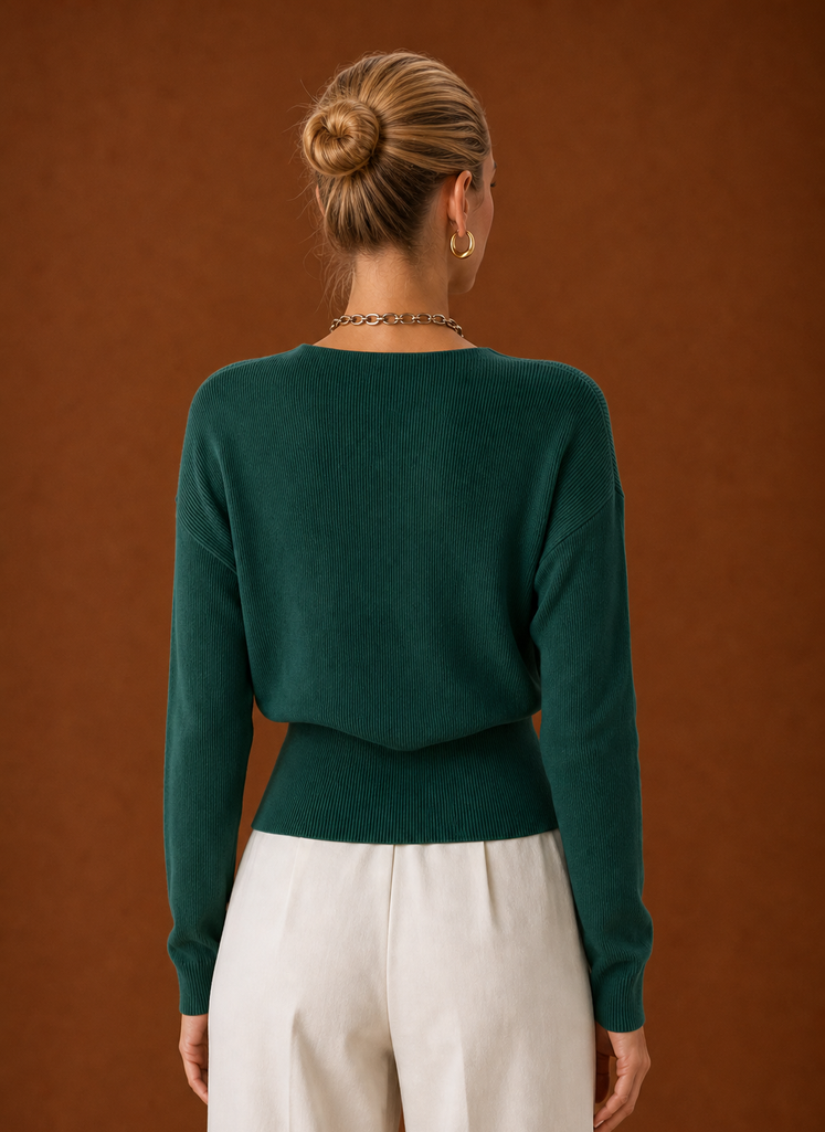 Back view of women's wrap sweater with clean hemline