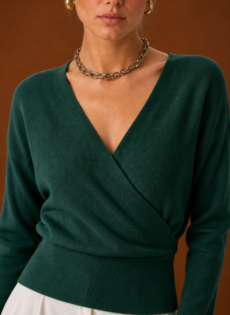 Close-up of knit texture and tied waist detail on V-neck wrap sweater