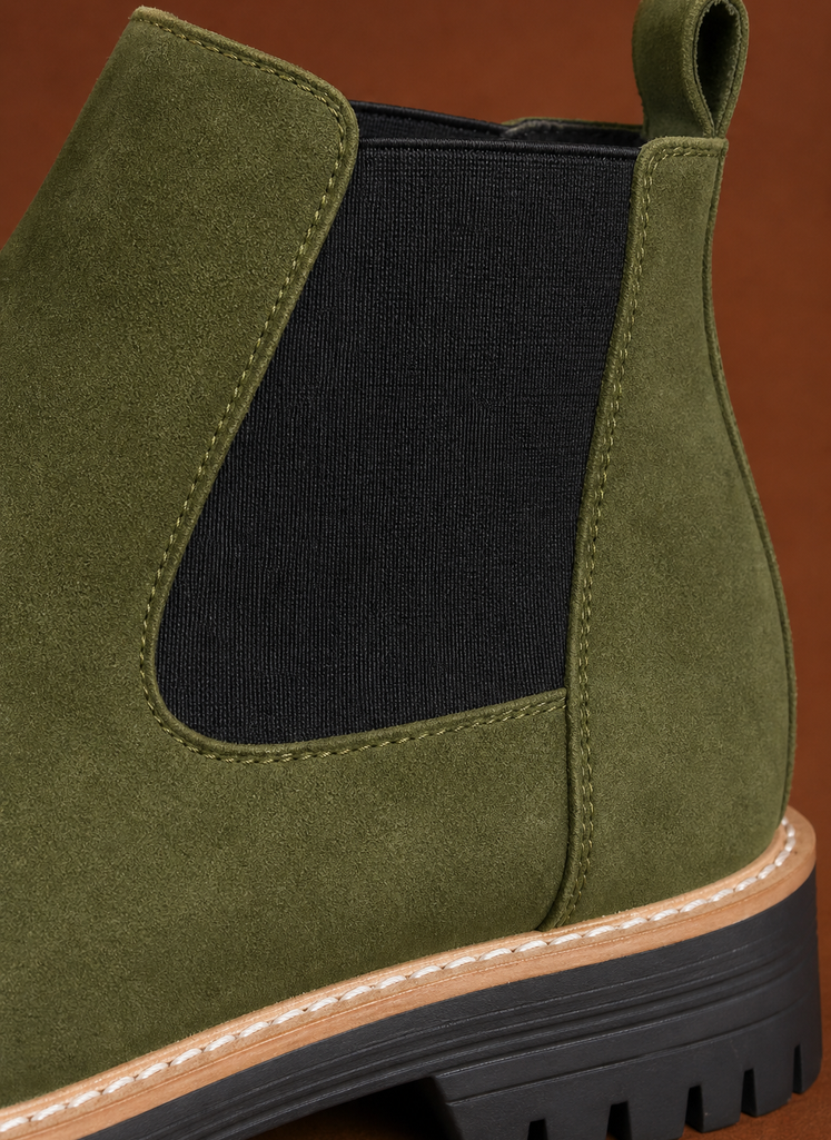 Close-up of chunky lug sole and stitching detail on women's Chelsea boot