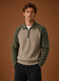 Front view of men's half-zip knit sweater on a mannequin