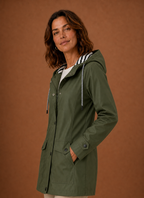 Side profile of women's hooded trench coat highlighting sleeve length and straight fit