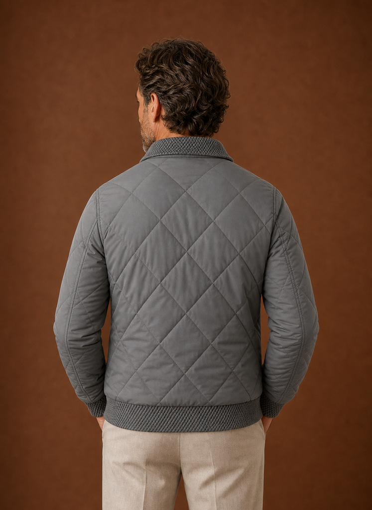 Back view of men's quilted bomber jacket showing quilted pattern