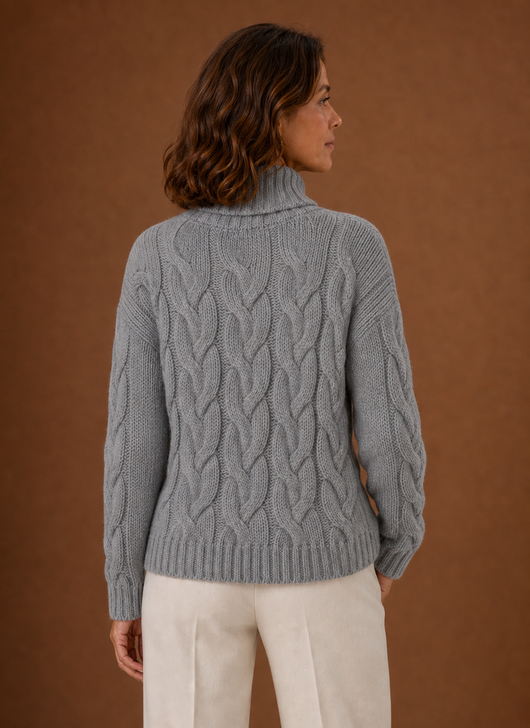 Back view of Areleon cable knit sweater highlighting overall knit texture