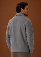 Back view of a men's crew neck knit sweater showing neckline and hem