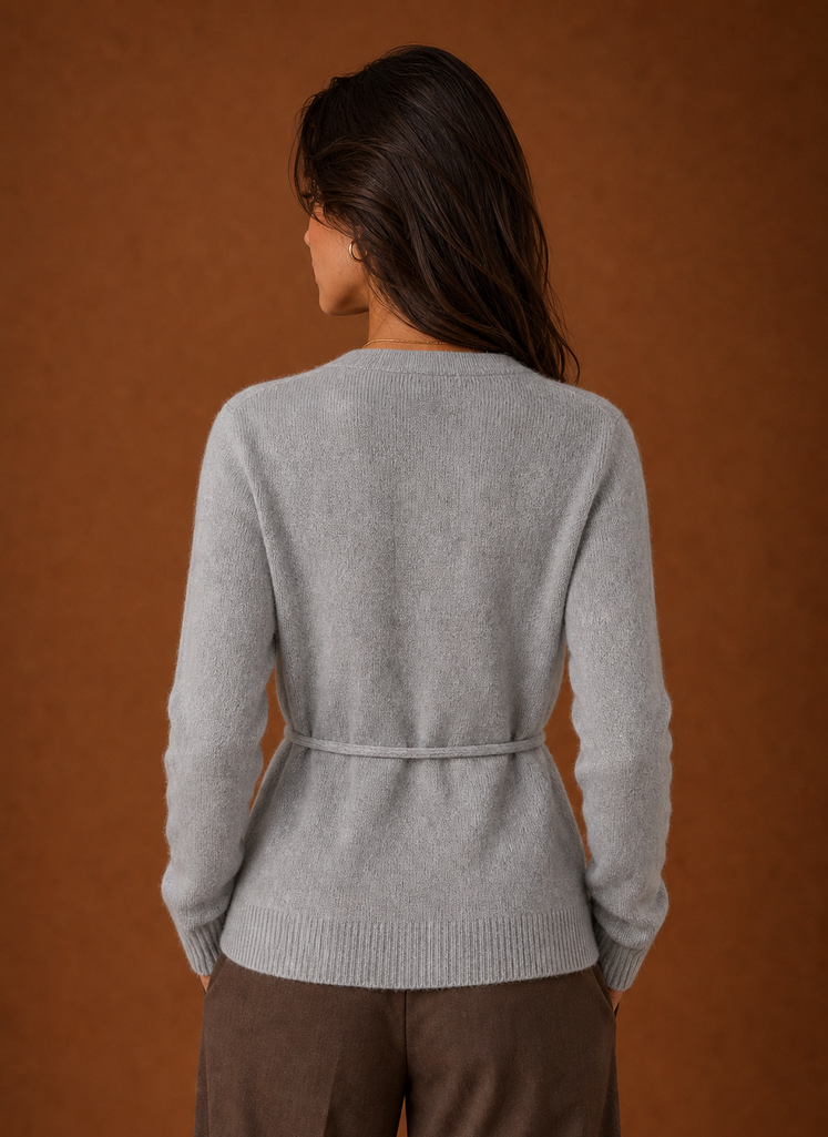 Back view of the women's wrap cardigan showing the knit back and belt detail