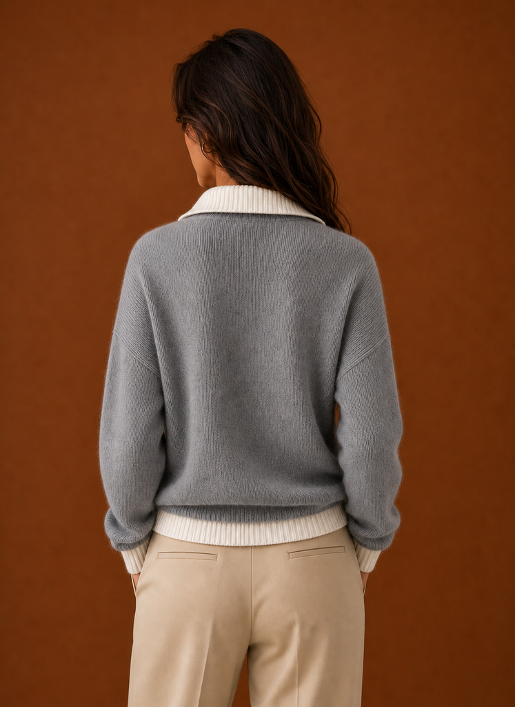 Back view of women's quarter zip sweater with a clean silhouette