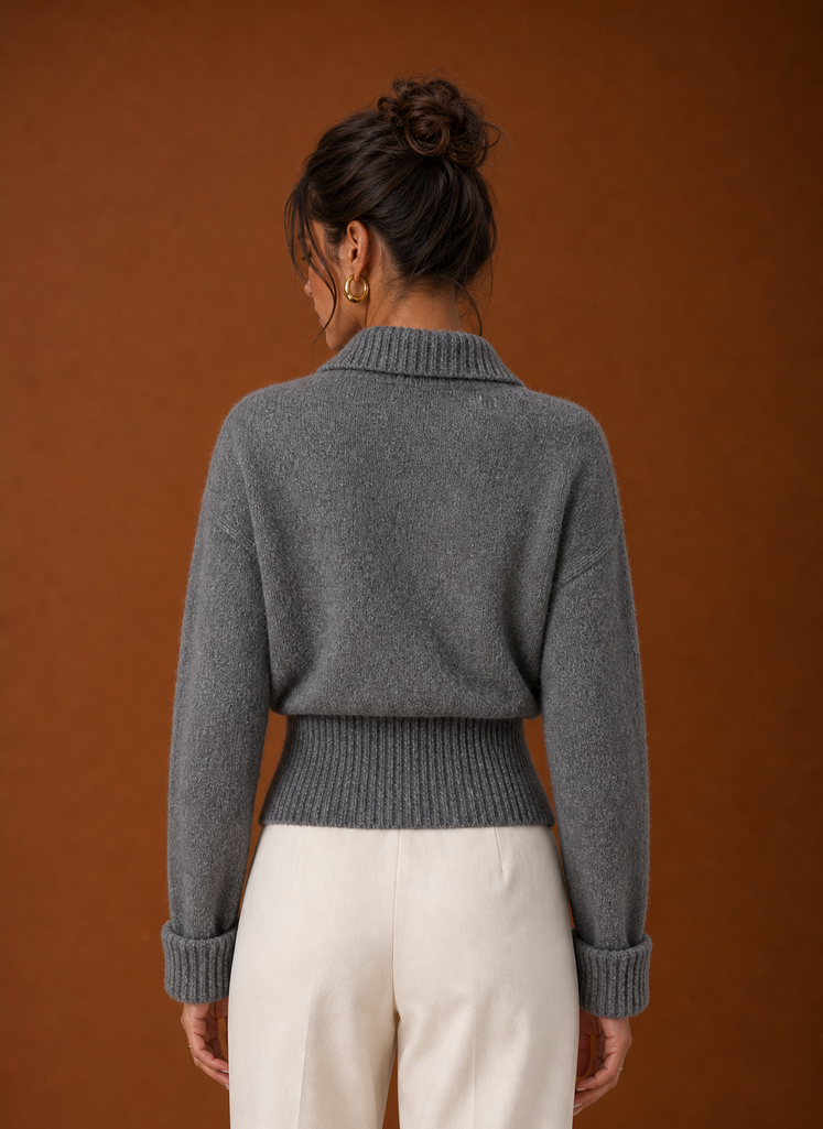Back view of ribbed knit sweater showing clean hemline and smooth back panel