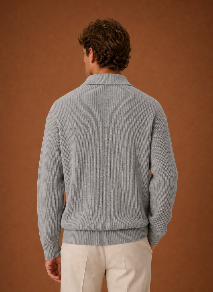 Back view of the oversized quarter-zip knit sweater with a clean knit finish