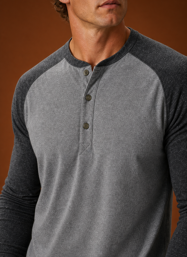 Close-up of the button-placket and neckline detailing on the Henley shirt