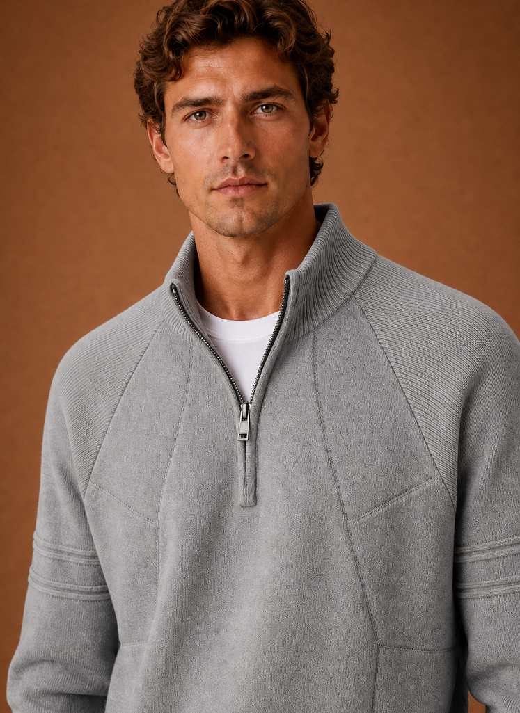 Close-up of the half-zip closure and knit texture at the collar