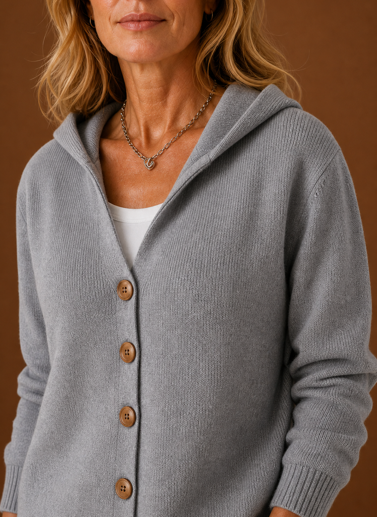 Close-up of button-front closure and hood seam detail on Areleon women's cardigan