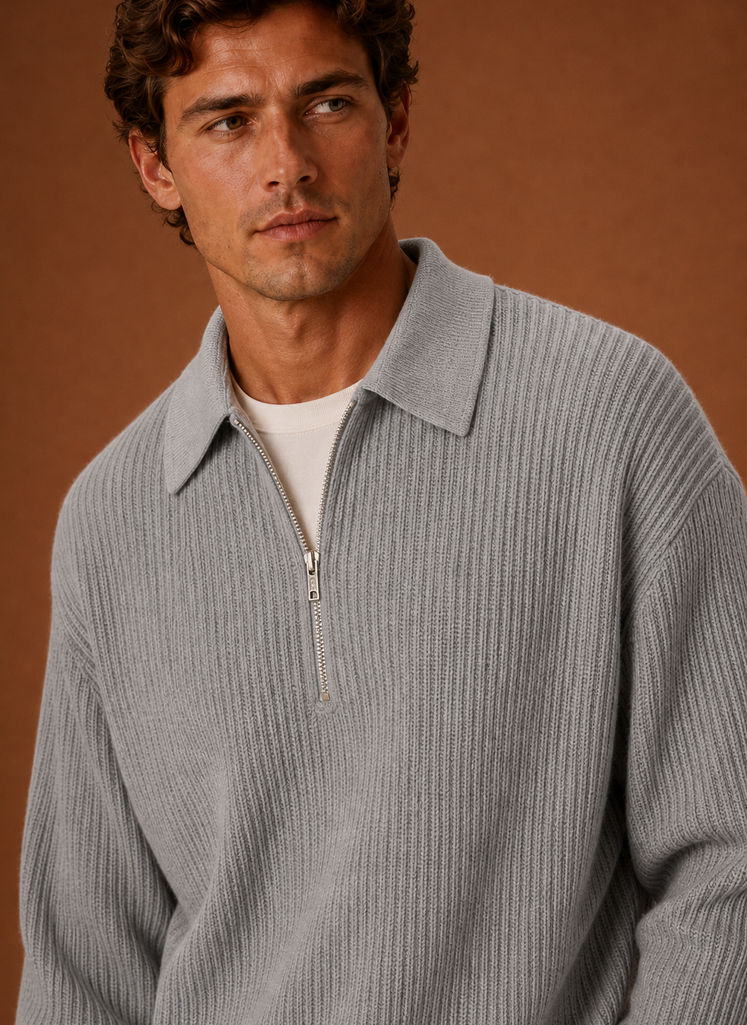 Close-up of the quarter-zip neckline and knit texture on the sweater
