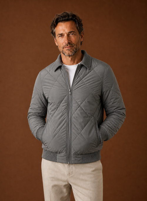 Front view of men's quilted bomber jacket with zip closure