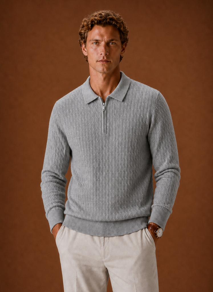 Front view of men's oversized half-zip pullover showing ribbed texture and zipper neckline
