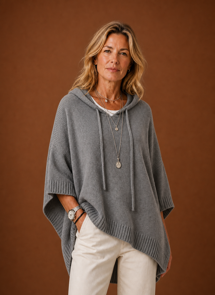 Front view of oversized hooded pullover on mannequin showing hood and relaxed fit