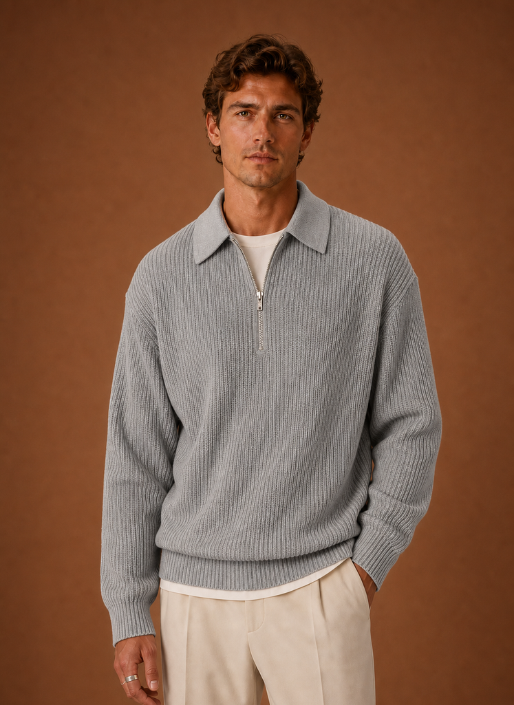 Front view of oversized quarter-zip knit sweater on a neutral background