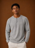 Front view of men's waffle knit Henley shirt showing button placket and textured knit