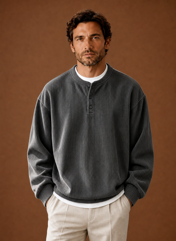Front view of men's grey ribbed long-sleeve henley shirt on neutral background