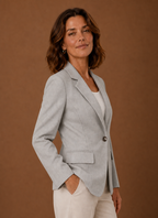 Side profile of women's tailored blazer showing tailored fit and long sleeve silhouette