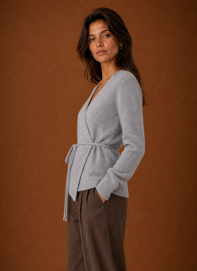 Side view showing the wrap silhouette and tied waist of the women's cardigan