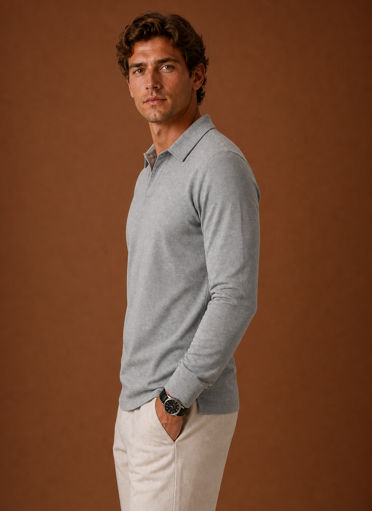Side view of men's polo shirt displaying sleeve silhouette and straight hem in grey