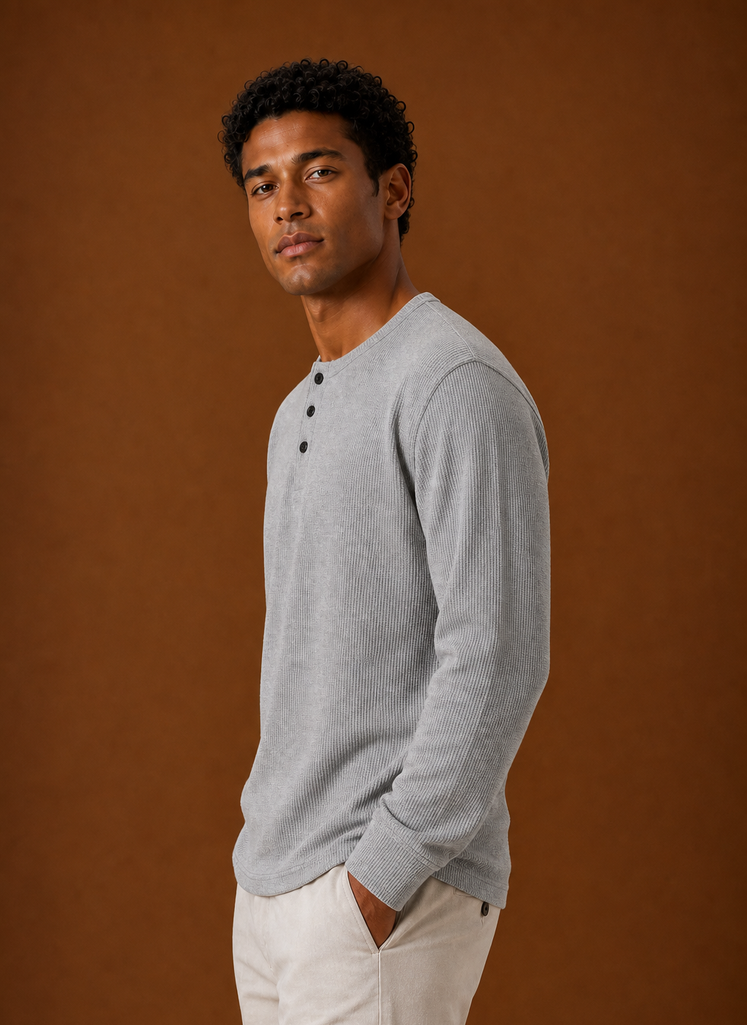 Side profile of men's Henley shirt displaying sleeve and silhouette
