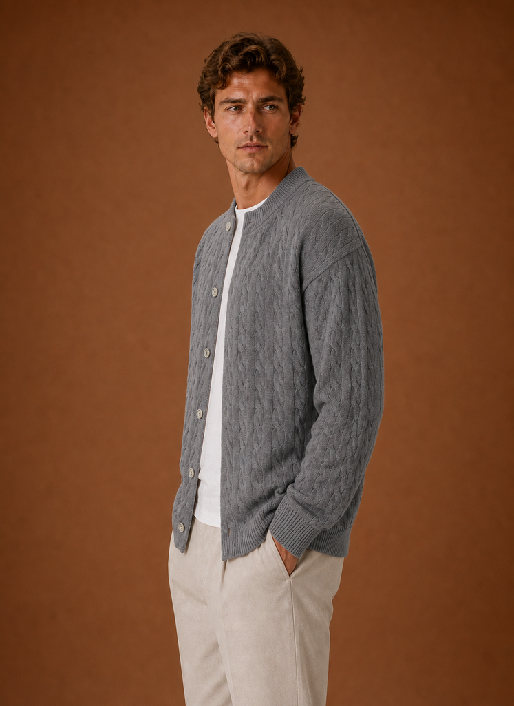 Side profile of men's cable knit cardigan showing long sleeve silhouette