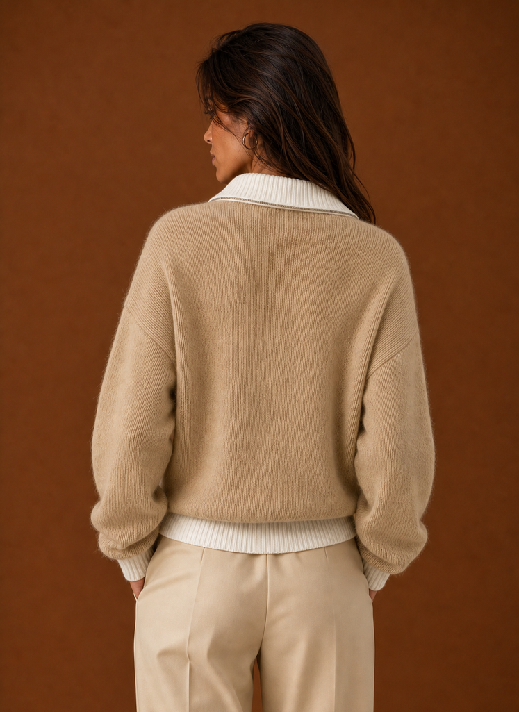 Back view of women's quarter zip sweater with a clean silhouette