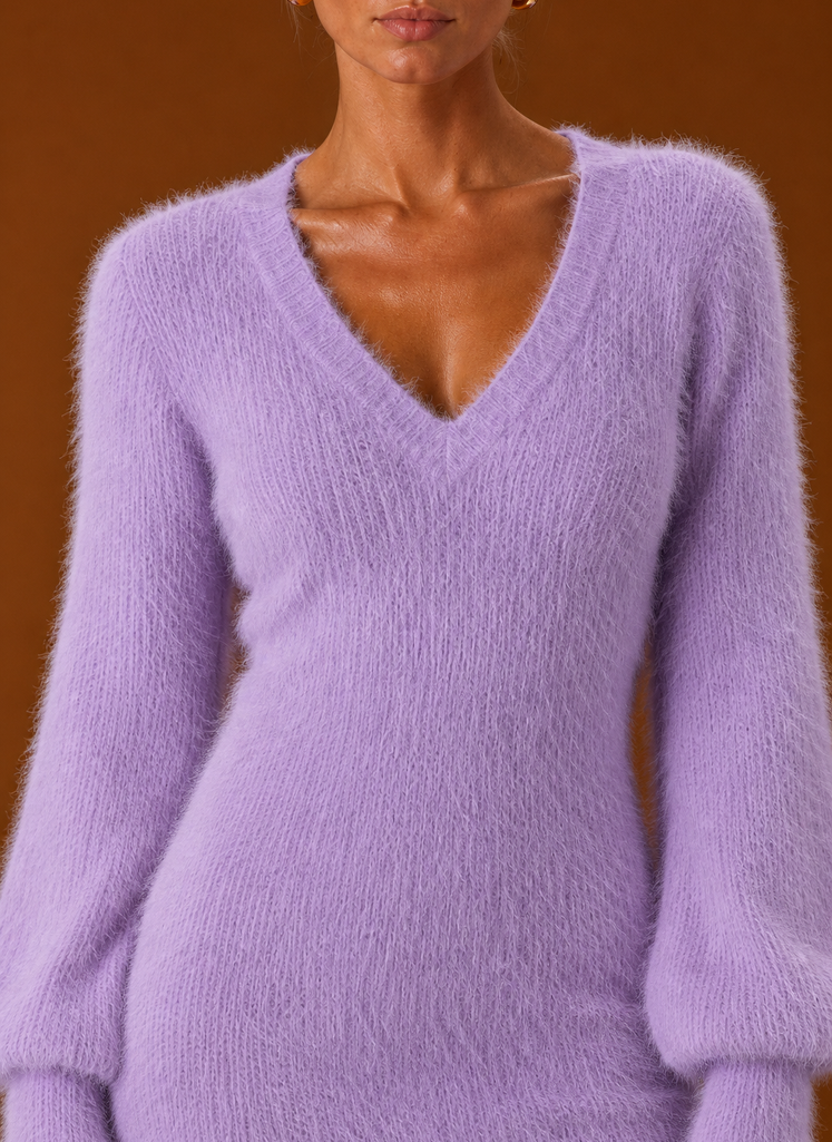 Close-up of Areleon sweater dress showing ribbed cuff and hem detail