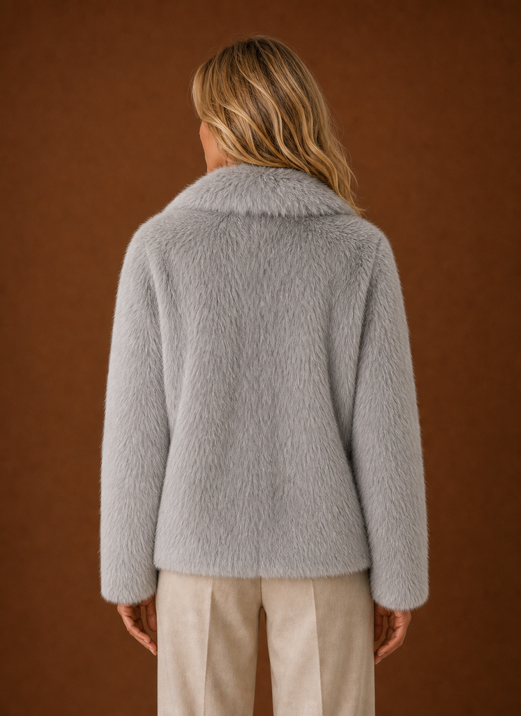 Back view of women's faux fur coat with smooth, clean lines