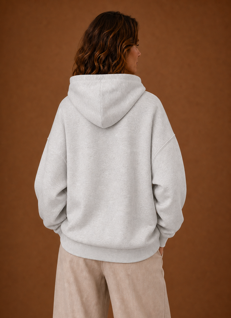 Back view of women's oversized hoodie with hood down and plain back