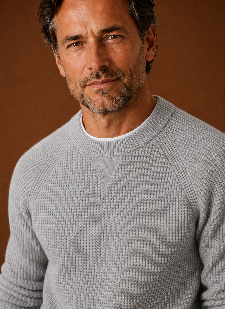 Close-up of textured waffle knit pattern and crew neckline on Areleon men's sweater