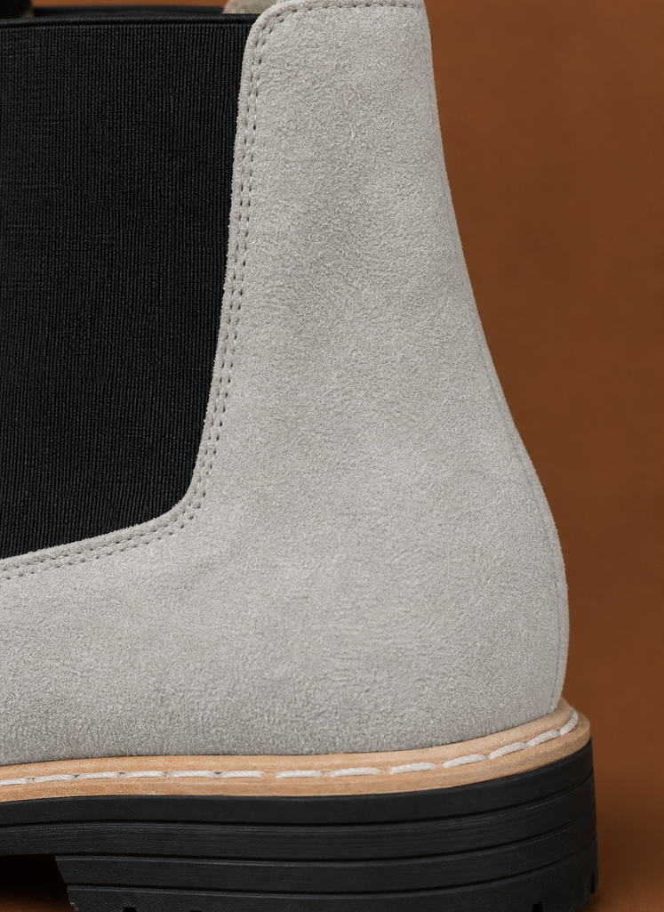 Close-up of chunky lug sole and stitching detail on women's Chelsea boot