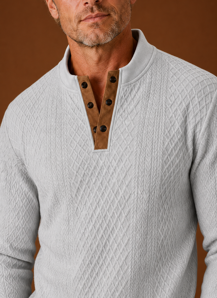 Close-up of crew neckline and knit texture on men's sweater