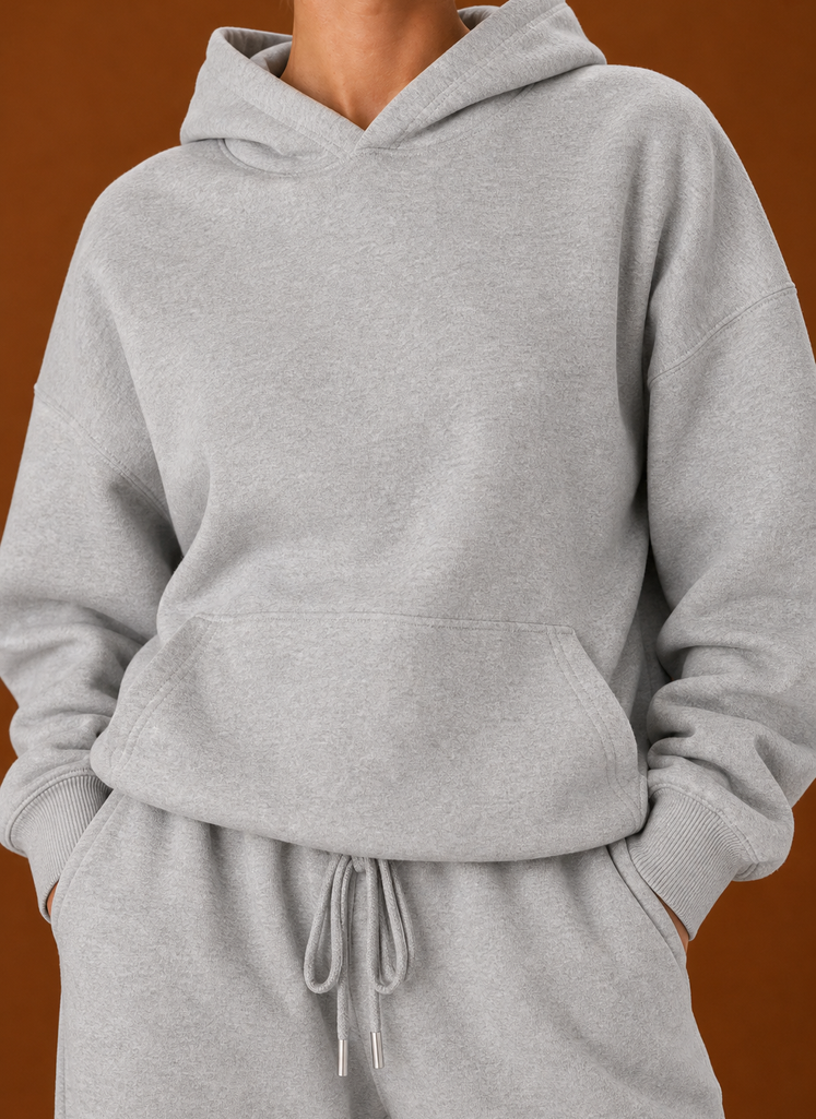 Close-up of the sweater and pants showing fabric texture and seam details