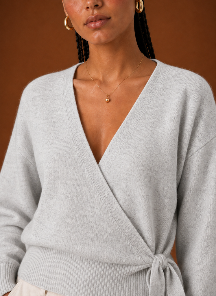 Close-up of the tie waist knot and V-neckline detailing