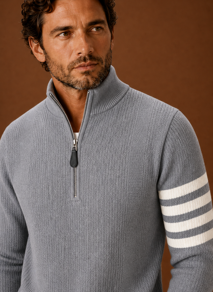 Close-up of the knit texture and half-zip closure with stripe detail