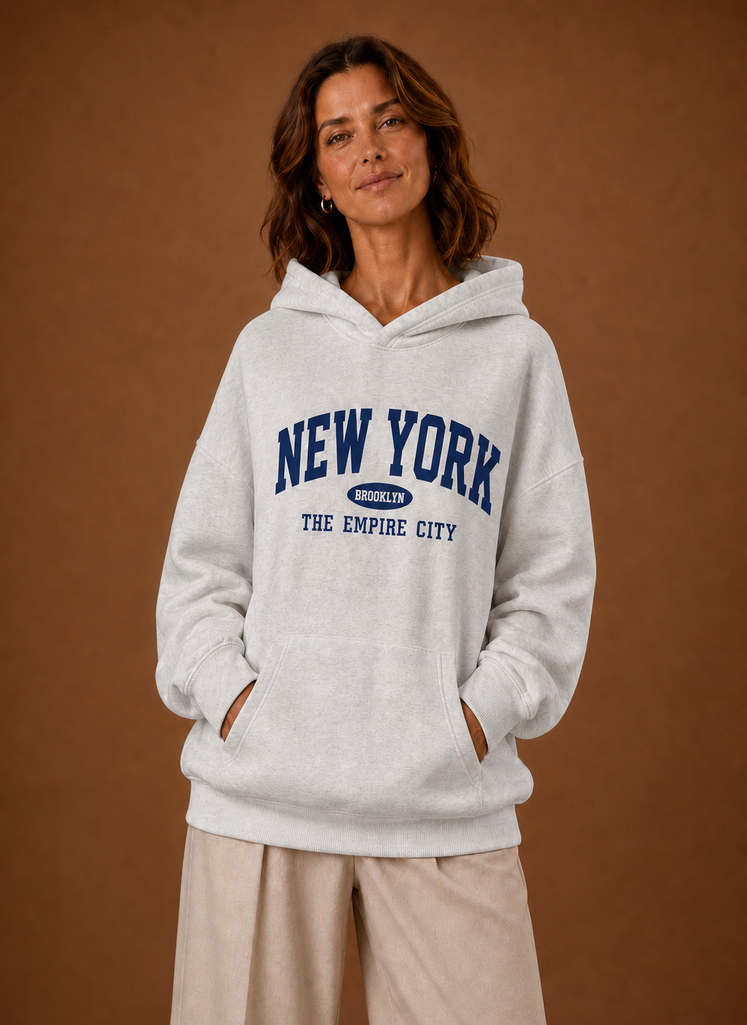 Front view of women's oversized hoodie with New York graphic on the chest