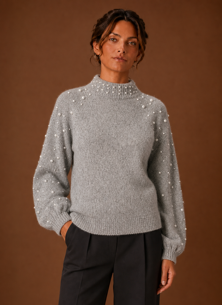 Front view of women's pearl embellished knit pullover sweater