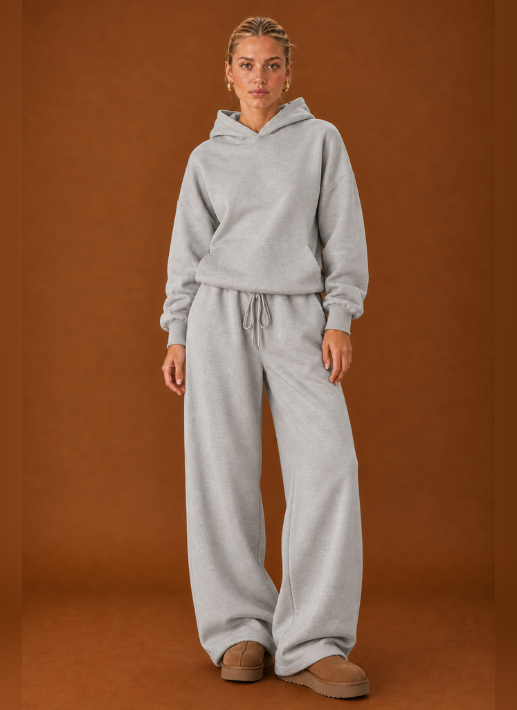 Front view of two-piece sweatsuit set showing sweater and pants on a model