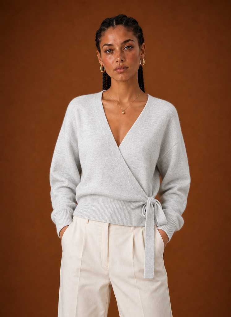 Front view of a women's cropped wrap sweater showing V-neck and tied waist
