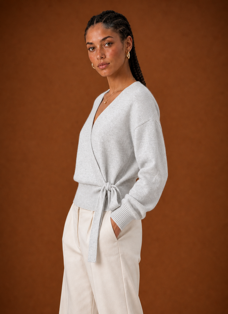 Side profile of the wrap sweater highlighting cropped length and wrap silhouette