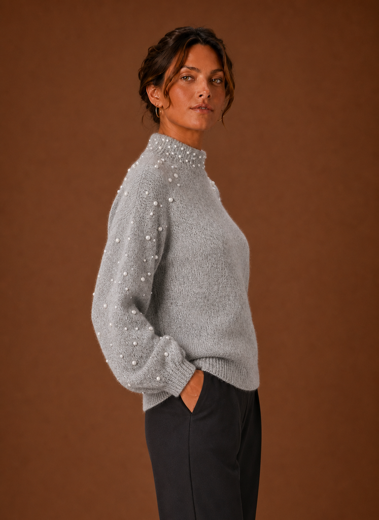 Side view of women's pearl embellished knit pullover showing silhouette