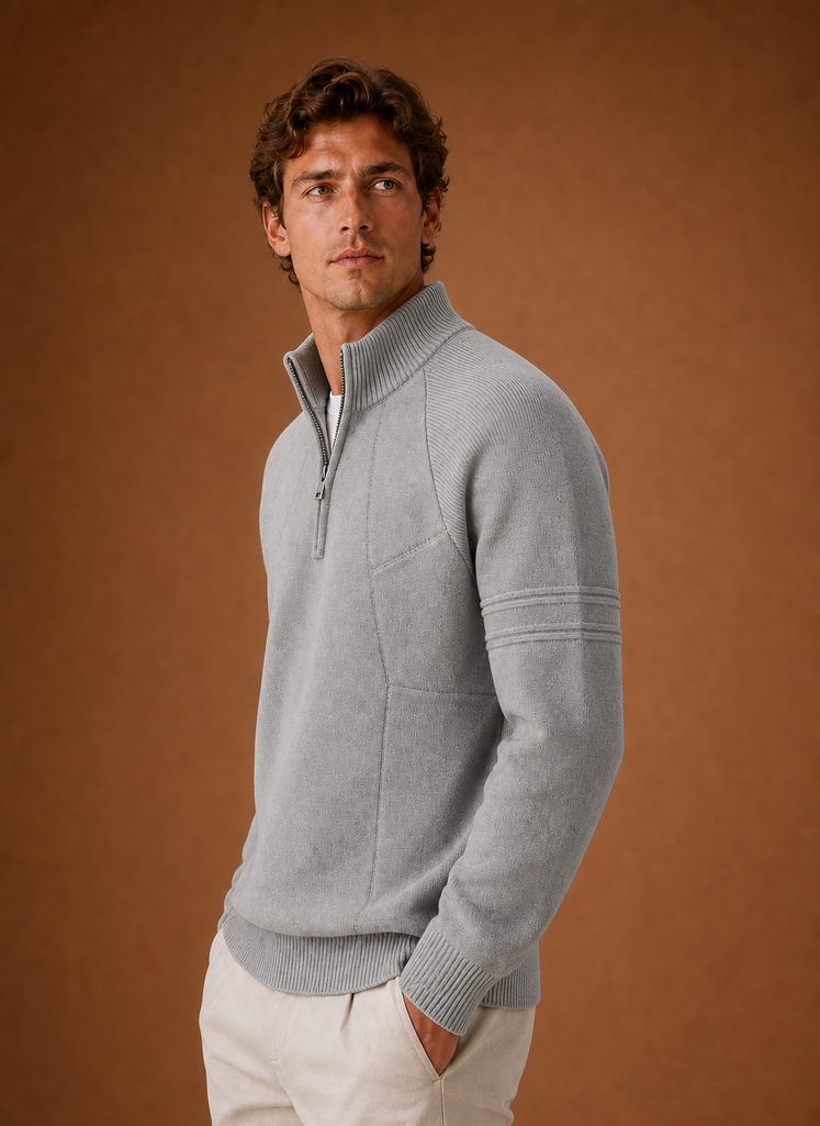 Side profile of men's half-zip knit sweater showing the zip neckline and sleeve