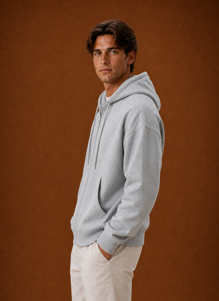Side view of hoodie highlighting the attached hood and zip closure