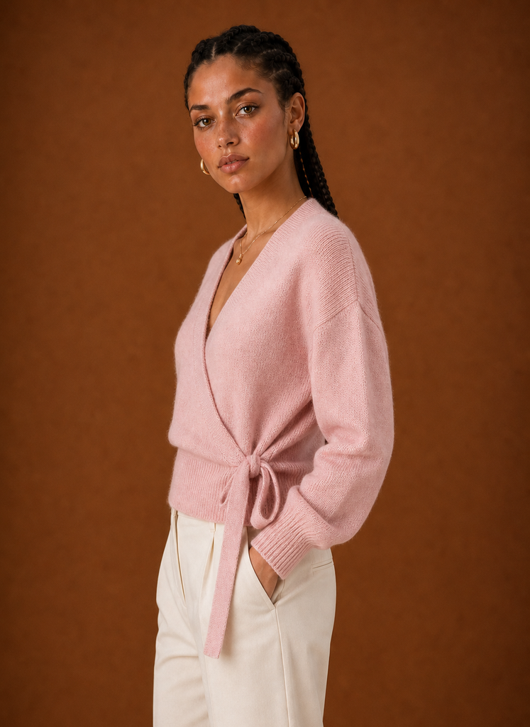 Side profile of the wrap sweater highlighting cropped length and wrap silhouette