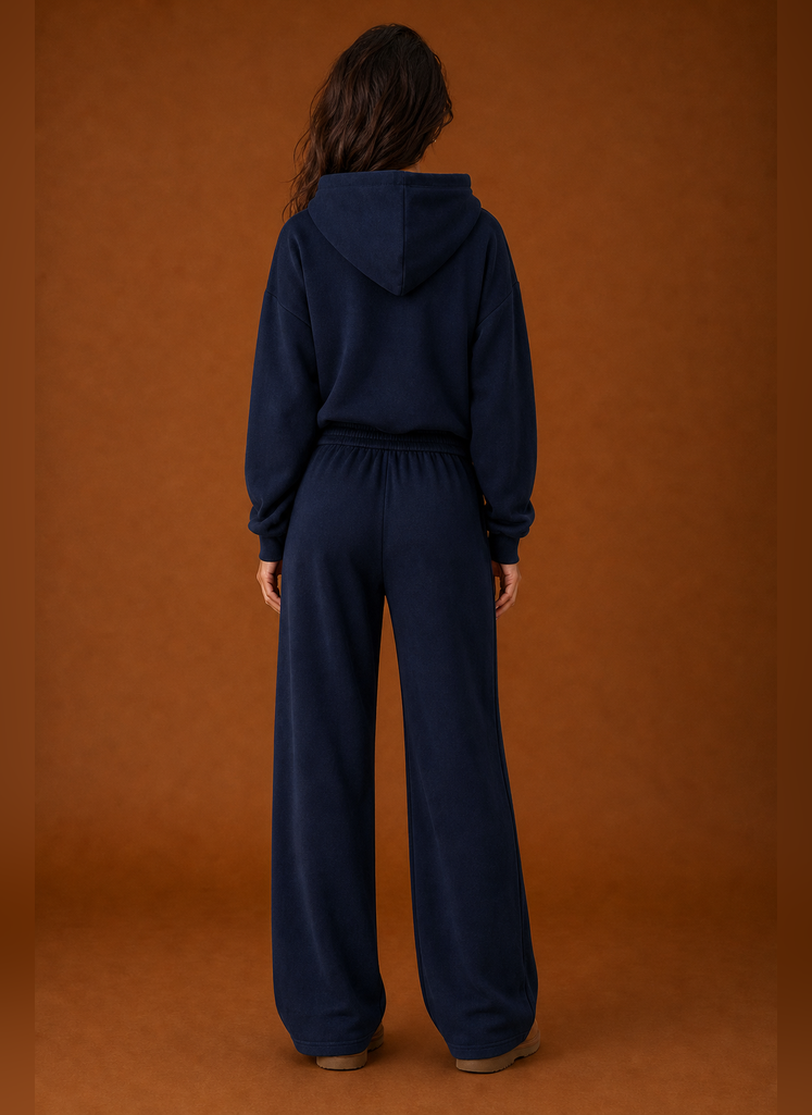 Back view of the two-piece women's sweatsuit showing sweatshirt and matching pant details