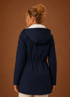 Back view of the long women's parka jacket with hood